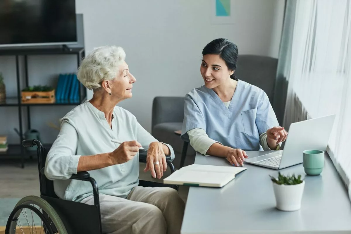 Young nurse assisting senior woman.jpg
